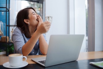 woman with laptop in cafe