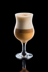 Cup of layered caramel macchiato coffee isolated on black background