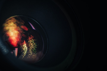 Beautiful camera aperture lens with multi colored shine glass reflection. Macro view.