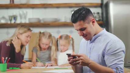 Young family in kitchen together