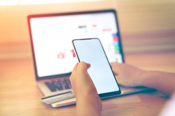 Online Shopping Website on Laptop. Easy E-commerce Website Shop by Smartphone