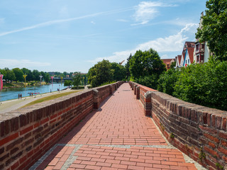 Walking path above Ulm city wall or, the town walls were built into the “raging waters of the Danube” as a defence against hostile armiessmall island (insel) in Danube river, Ulm.