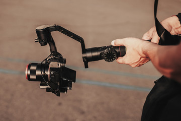 Professional record. Videography. Hand with cinematic digital equipment. Record device. Camera...