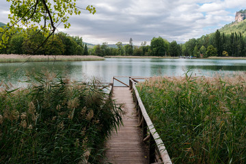 Landscape of a lake where appears a footbridge