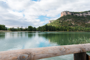 Landscape of a lake where appears a footbridge
