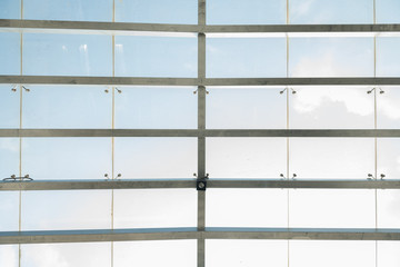 Interior metal frame grid glass roof background texture closeup