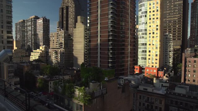 Midtown Manhattan NYC garden rooftops and buildings summer early morning.mov