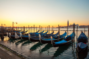 Sunrise at Venice with gondola and island of st george view from the square San marco