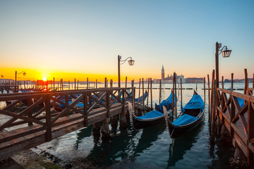 Gondolas by Saint Mark square at sunrise, Venice, Italy