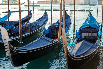Fototapeta na wymiar Gondolas by Saint Mark square at sunrise, Venice, Italy