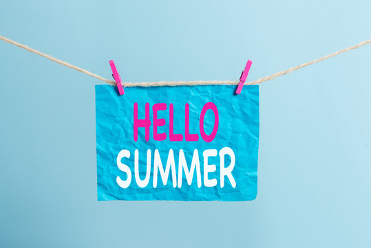Writing note showing Hello Summer. Business concept for Welcoming the warmest season of the year comes after spring Clothesline clothespin rectangle shaped paper reminder white wood desk