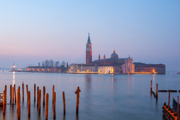 Fototapeta premium Sunrise at Venice with gondola and island of st george view from the square San marco