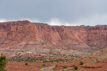 Capitol Reef National Park landscape of pink and red almost barren mountain and valley