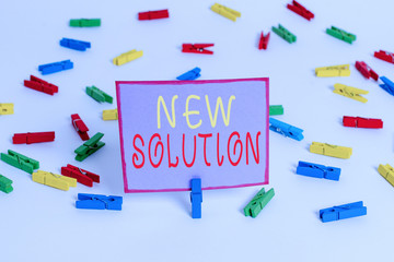 Conceptual hand writing showing New Solution. Concept meaning Modern Innovation Latest effective approach to a problem Colored clothespin papers empty reminder white floor office