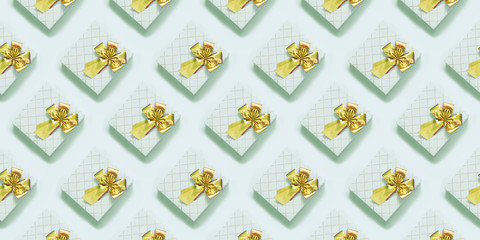 Neo mint gift boxes with golden ribbon on pastel blue surface. Top view. Seamless pattern.