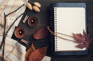 autumnal leaves and lit candles