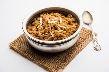 Wheat flour Halwa or Shira /  Atte ka Halva, Popular healthy dessert or breakfast menu from India. served in a bowl or plate. selective focus