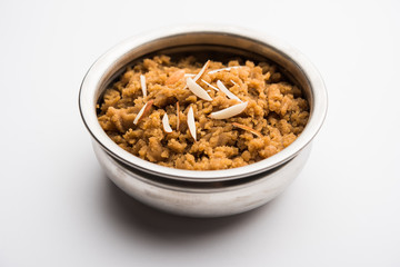 Wheat flour Halwa or Shira /  Atte ka Halva, Popular healthy dessert or breakfast menu from India. served in a bowl or plate. selective focus