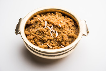Wheat flour Halwa or Shira /  Atte ka Halva, Popular healthy dessert or breakfast menu from India. served in a bowl or plate. selective focus