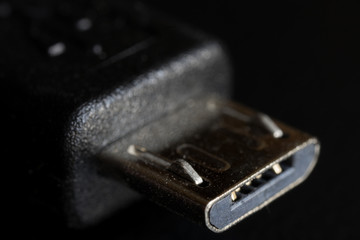 Close up of an Micro B sized of Universal Serial Bus (USB) cable. 