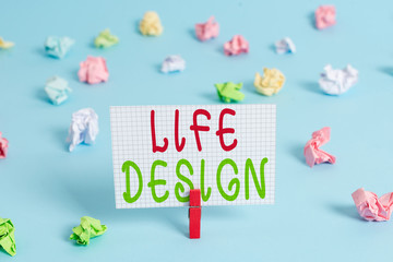 Conceptual hand writing showing Life Design. Concept meaning balance how you live between work family and entertaining Colored clothespin rectangle shaped paper blue background
