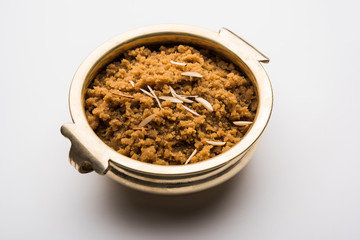 Wheat flour Halwa or Shira /  Atte ka Halva, Popular healthy dessert or breakfast menu from India. served in a bowl or plate. selective focus