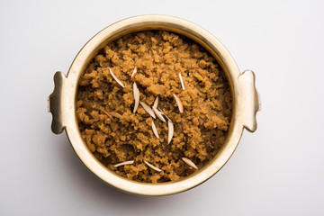 Wheat flour Halwa or Shira /  Atte ka Halva, Popular healthy dessert or breakfast menu from India. served in a bowl or plate. selective focus