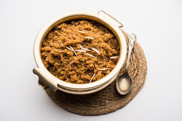 Wheat flour Halwa or Shira /  Atte ka Halva, Popular healthy dessert or breakfast menu from India. served in a bowl or plate. selective focus