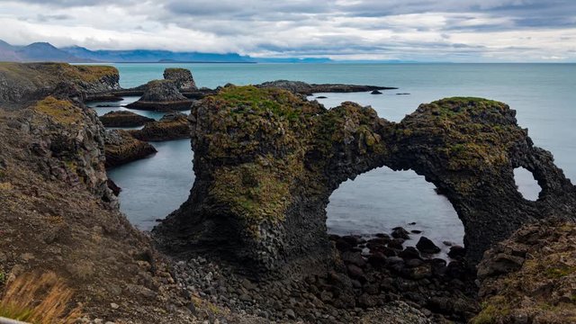 Timelapse view of volcenid basalt formations by a fjord in West Iceland