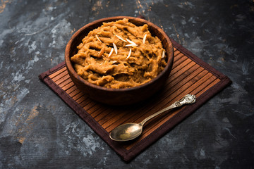 Wheat flour Halwa or Shira or porridge /  Atte ka Halva, Popular healthy dessert or breakfast menu from India. served in a bowl or plate. selective focus