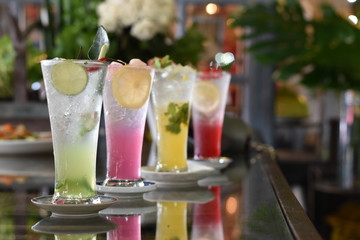 Colorful fruit juice, set of cold refreshing drink in summer season, holiday and party concept, selective focus and blur background.