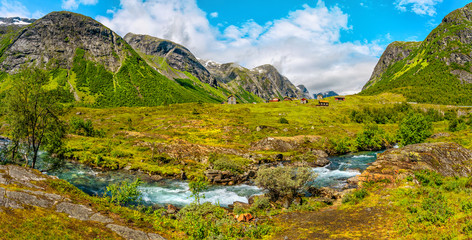 Norwegian landscape with milky blue river, and green mountains. Hjelledalen, Norway.