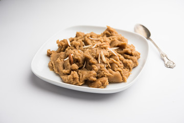 Wheat flour Halwa or Shira or porridge /  Atte ka Halva, Popular healthy dessert or breakfast menu from India. served in a bowl or plate. selective focus