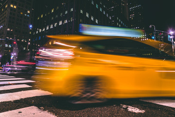 Capturing a yellow taxi with 1/4 shutter speed. New York.