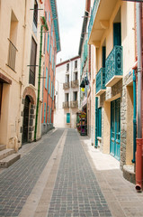 Pavement among houses on a narrow street