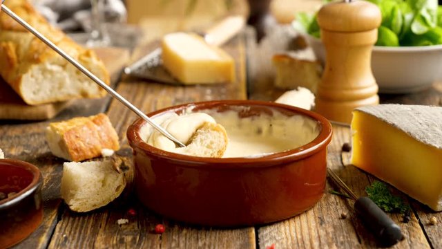 cheese fondue with wine, cheese and bread