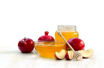 Honey, red apples, garnet on a white background with space for text