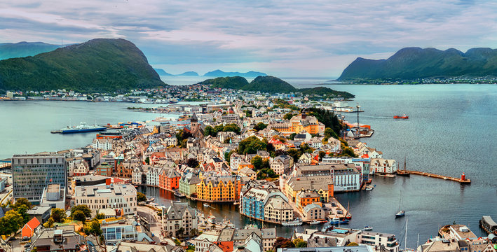 Alesund is a port and tourist city at the entrance to the Geirangerfjord.  Cityscape image of Alesund.