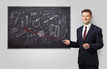 Handsome young teacher with laser pointer teaching