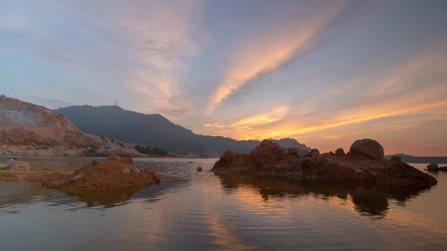 Timelapse sunset Tokkun hill with reflection. The rock can be seen in the lake.
