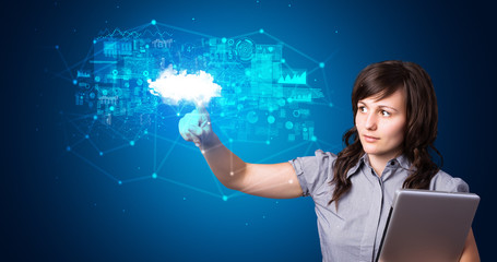 Woman touching hologram projection displaying information from cloud based system