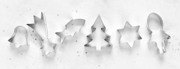 Cutters for cookies or gingerbread on white background, top view, space for text, banner