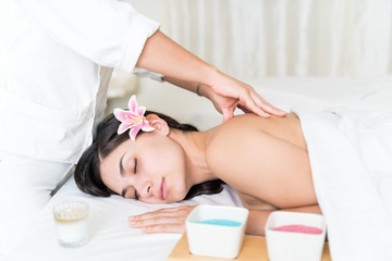 Fototapeta na wymiar Masseuse Massaging Woman's Back At Spa