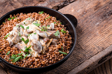 buckwheat porridge in a pan with mushroom seasoning