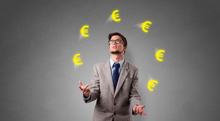 Young happy person juggle with euro symbol