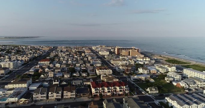 View from aerial drone flying over New Jersey beach town in evening time around sunset Wildwood