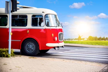 Zelfklevend Fotobehang Bus traveling . the red bus in retro style . Tourism by bus in rural areas © yaalan