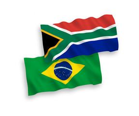 National vector fabric wave flags of Brazil and Republic of South Africa isolated on white background. 1 to 2 proportion.