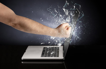 Hand hitting strongly laptop screen glass