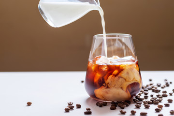 a glass of cold brew coffee with milk summer beverage